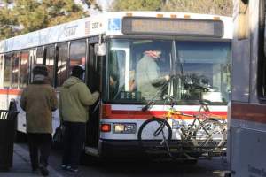 people getting on city bus debt broke