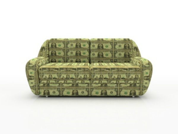 Sofa with dollars isolated on white background