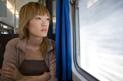 Worried-woman-on-train