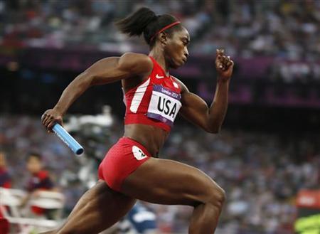 Tianna Madison of the U.S. competes in her women's 4x100m relay heat during the London 2012 Olympic Games at the Olympic Stadium
